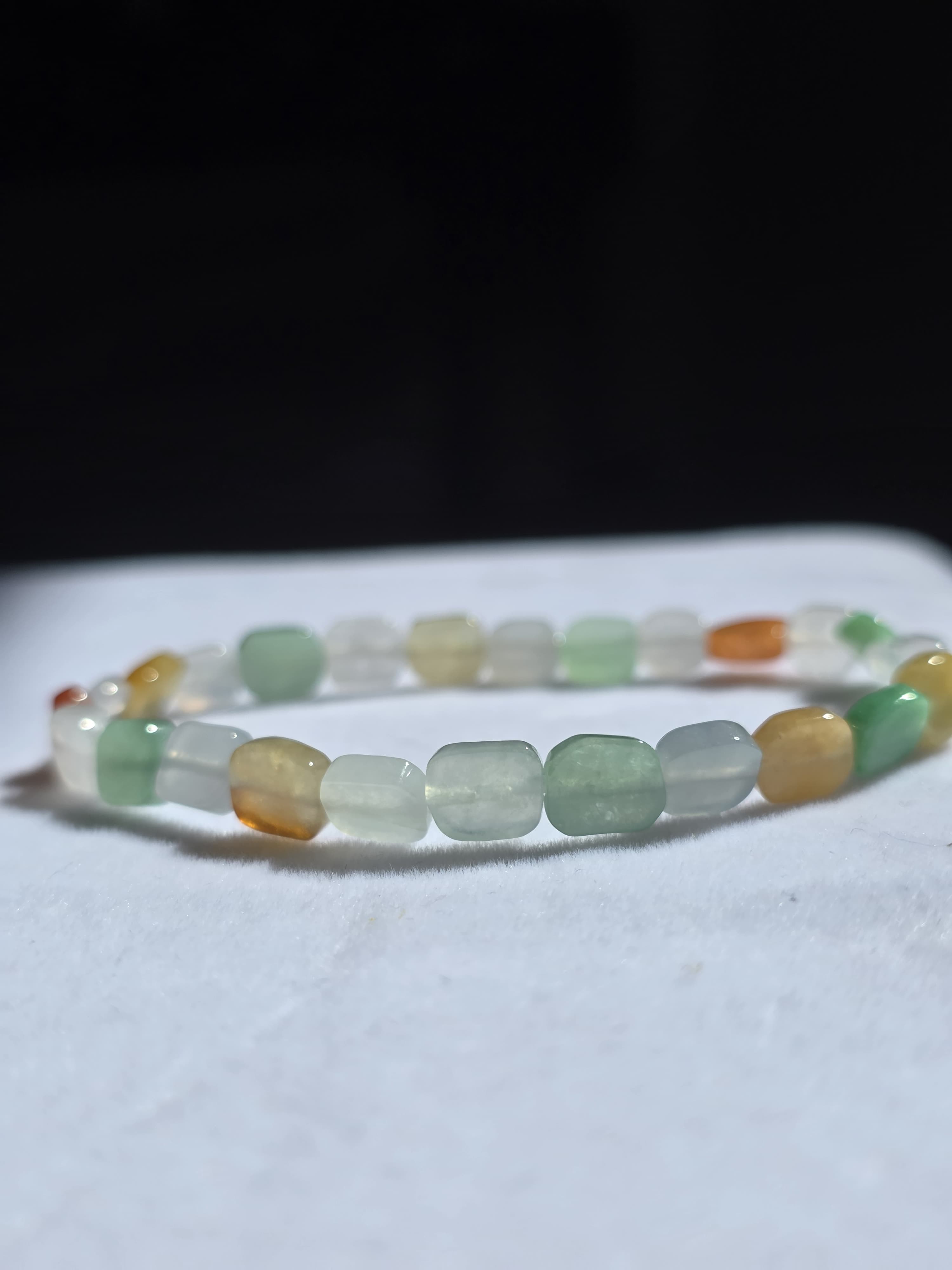 Jade bead bracelet on dark velvet